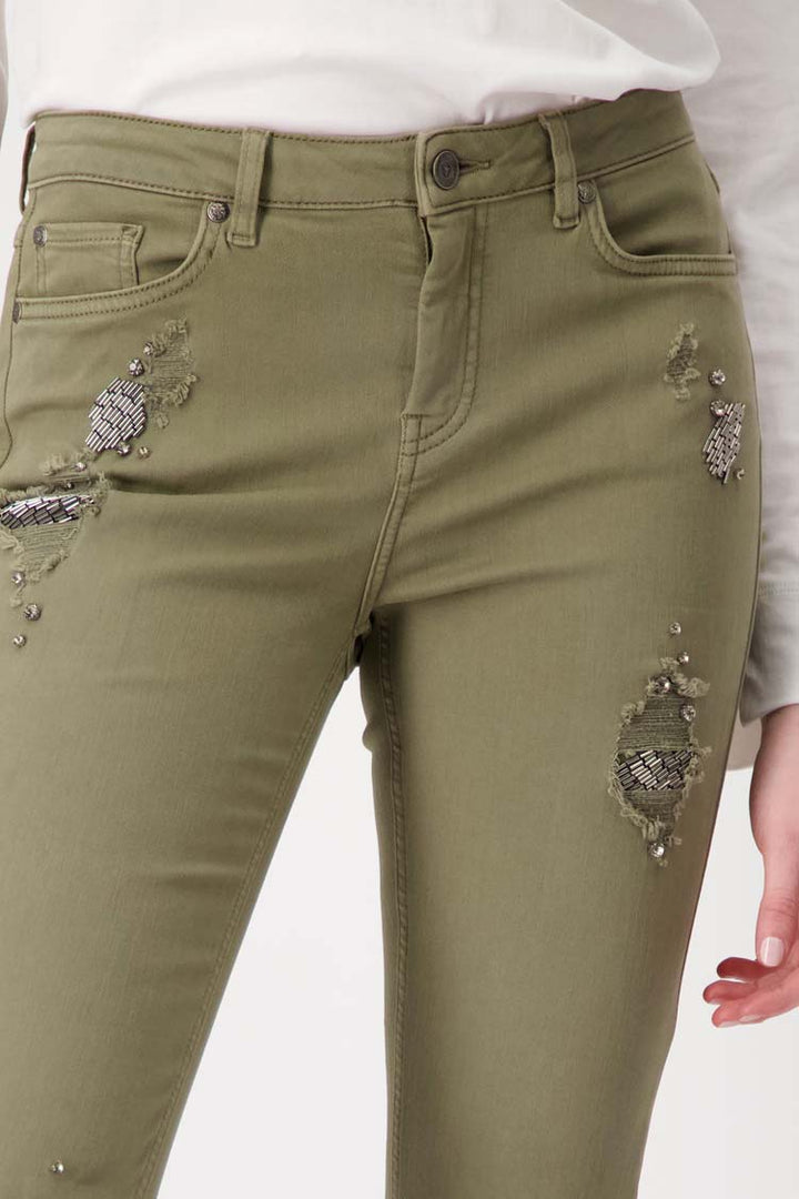 Distressed Denim Jeans with Studs in Green Tea